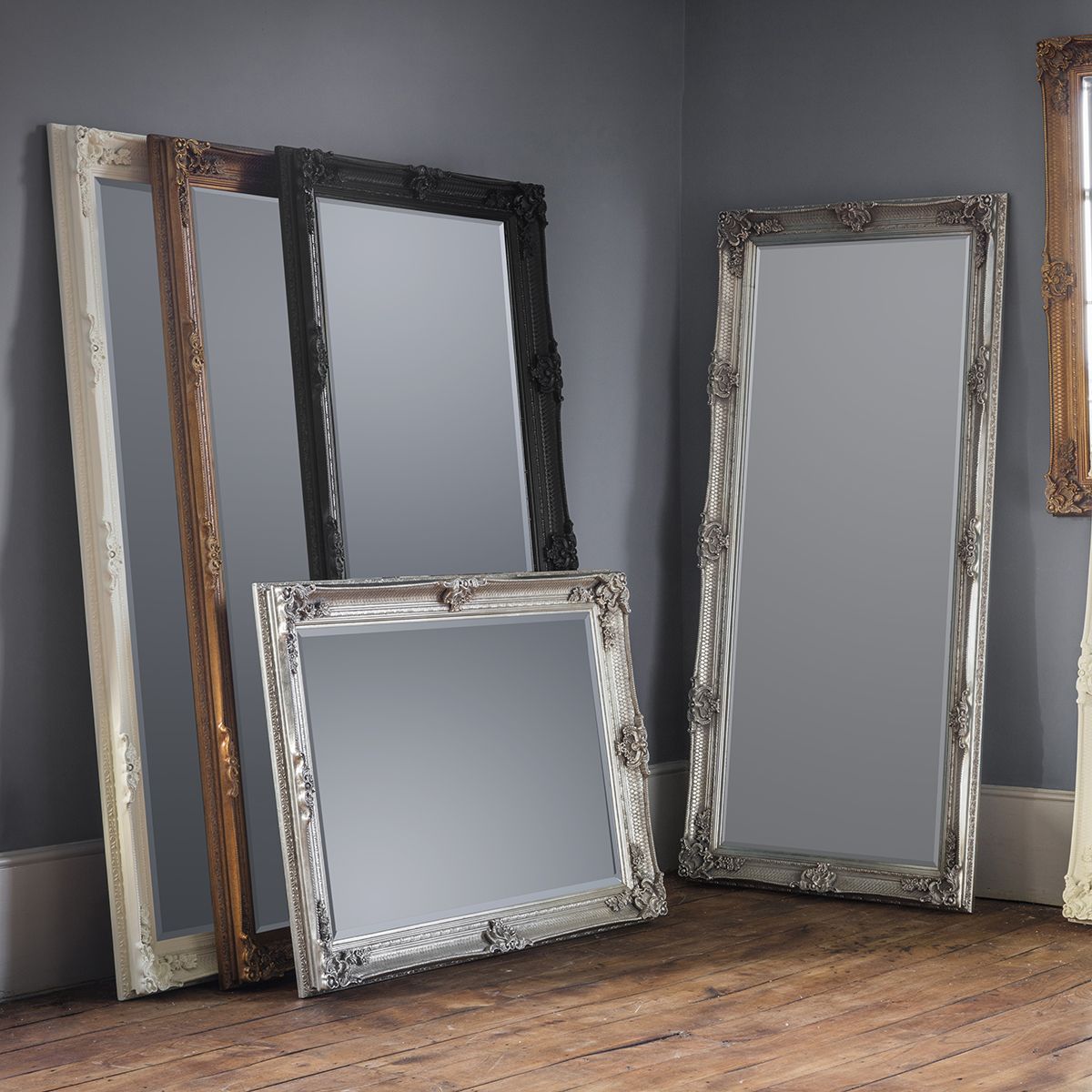 A collection of ornate framed mirrors in cream, gold, black and silver