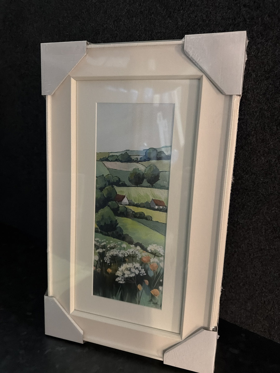 Greenacres Detail II By Elizabeth Baldin - patchwork fields, red-roofed cottages, cow parsley and poppies, cream frame