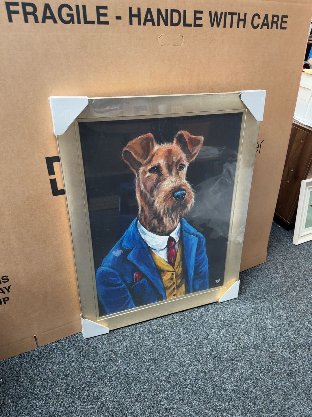 Louise Brown dog portrait artwork in a gold frame